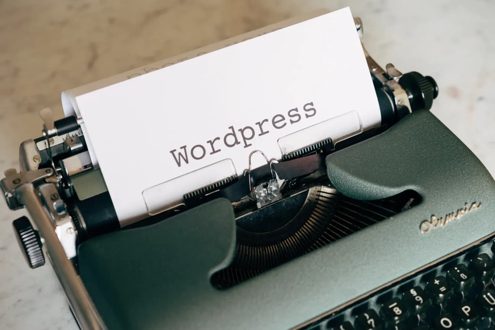 Close-up of a vintage typewriter with paper labeled Wordpress.