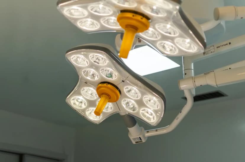 Bright LED surgical lights in a hospital operating room, emphasizing technology and healthcare.