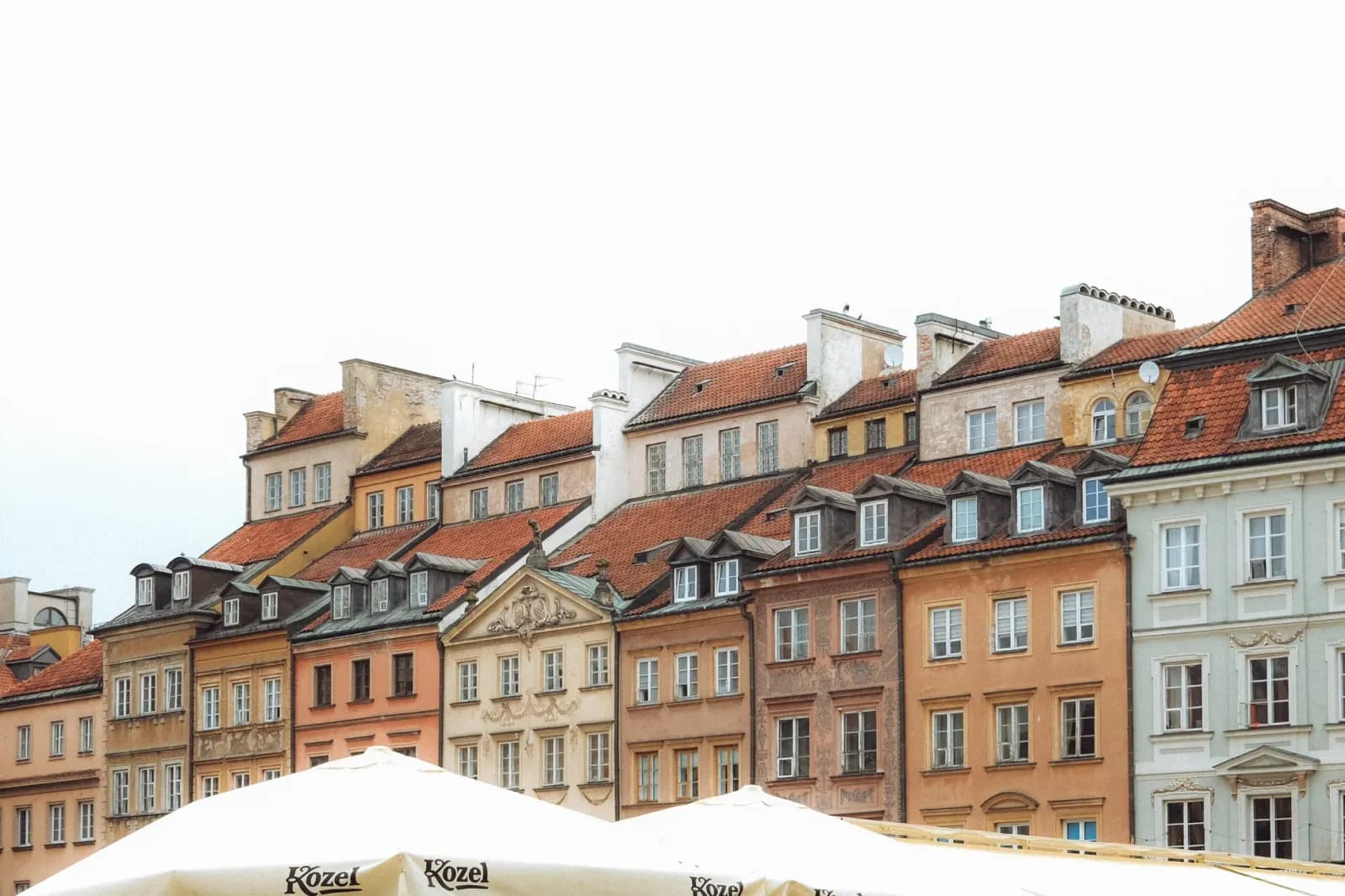 Vibrant facade of historic buildings in Warsaw's Old Town, a UNESCO heritage site.