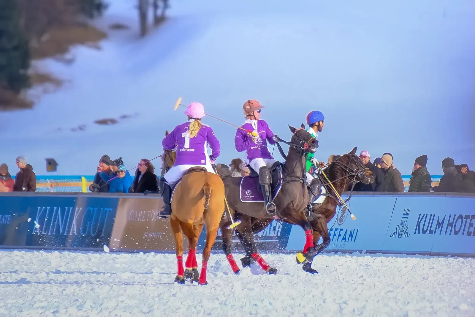Exciting snow polo game with players and horses in vibrant winter scene.